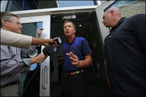 Ohio Gov. John Kasich arrives with staff for a closed door meeting with Toledo Mayor D. Michael Collins and other dignitaries to address the water emergency in the city.