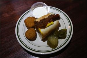 A Hungarian hotdog, with fried and spicy pickles served at Tony Packo's.