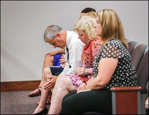 Family members of Emilee Gagnon, including her father, John Gagnon, left, and her aunt, Ann Marie Osmer listen to the proceedings in Ottawa County Municipal Court. Miss Gagnon was on her way to San Francisco to raise funds for multiple sclerosis. She was to stop in Perrysburg for the night.