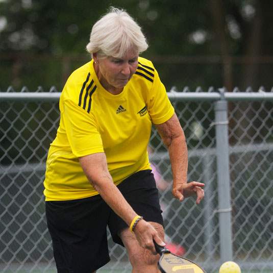 SPT-Pickleball06Connie-Mierzejewski-serves-the-ball-during-a-match