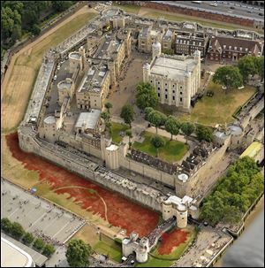 A sea of red ceramic poppies which form part of an art installation to commemorate World War I is seen in the dry moat of the Tower of London. When completed, 888,246 ceramic poppies will represent each of the British and Commonwealth soldiers killed in the war.