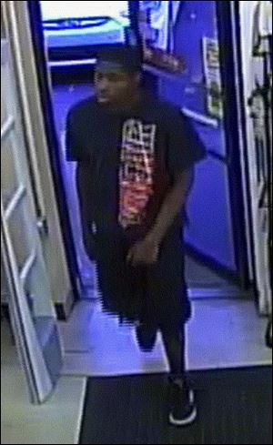 A black male believed to be a suspect in Sylvania Township for stealing and fraudulently using credit cards.
