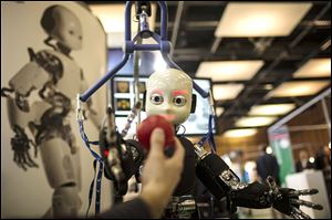 Respondents in a survey were split on whether robots will kill or create jobs 11 years from now.