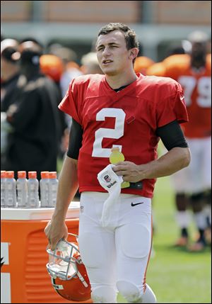 Cleveland Browns quarterback Johnny Manziel walks off the field after practice today.