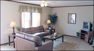 The comfortable living room welcomes you home.