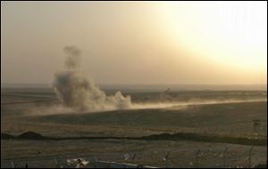 Smoke rises from airstrikes targeting Islamic State militants near the Khazer checkpoint outside of the city of Irbil today in northern Iraq.