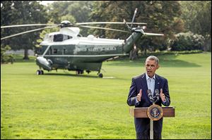 President Obama speaks to the media on the South Lawn of the White House on Saturday.