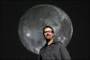 Michael Cushing, professor of physics and astronomy at the University of Toledo, inside the Ritter Planetarium where he is the director.