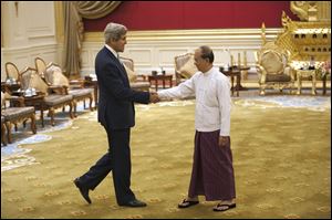U.S. Secretary of State John Kerry, left,  shakes hands with Myanmar President Thein Sein during their meeting Saturday at the Presidential hall outside the venue of the 47th ASEAN Foreign Ministers' Meeting in Naypyidaw.