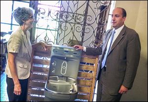 Sister Janet Doyle, Sylvania Franciscan Village Administrator and founder of the Green Fund, left, and Dean Ryan Butt partnered to implement the refillable water stations on campus.
