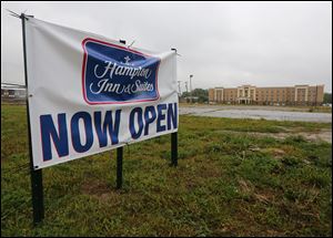 New Hampton Inn on Secor Road is open, while work on a Holiday Inn Express will begin in March.