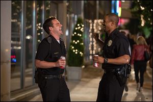 Damon Wayans, Jr., right, and Jake Johnson in a scene from, 