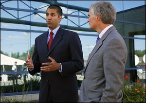 FCC Commissioner Ajit Pai, left, and U.S. Rep. Bob Latta (R., Bowling Green) speak to the media after touring the Buckeye CableSystem facility.