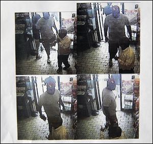 These images provided by the Ferguson Police Department show security camera footage from a convenience store in Ferguson, Mo., on Aug. 9, the day that Michael Brown was fatally shot by a police officer. A report released Friday says the footage shows a confrontation between Brown and an employee at the store. The report says that Brown and his friend, Dorian Johnson, stole a box of cigars from the store shortly before Brown's death. 