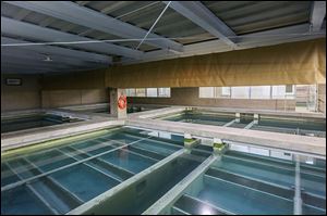 Water slowly filters in pools inside the Collins Park Water Treatment Plant in East Toledo. The plant began an ongoing $264 million upgrade of its facilities last year.