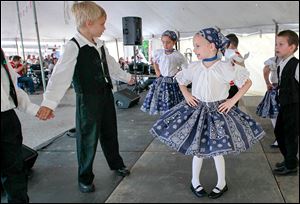 Members of the Hungarian dancing group Kis Szivek from Detroit perform during the Birmingham Ethnic Festival Sunday on Consaul Street as the aromas of Hungarian specialties fill the air.