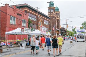 Visitors take in the 40th annual Birmingham Festival, which is billed as ‘‍A Weekend in the Old Country.’   