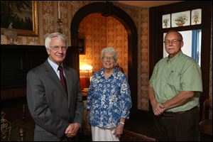 Charlie Boxell, the board president, left, curator Marilyn Wendler, and Jack Hiles, executive director of the Maumee Valley Historical Society, stand in the Wolcott House in Maumee.