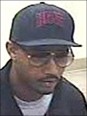Police are looking for this man in a robbery of a Fifth Third Bank inside a Kroger in Toledo.