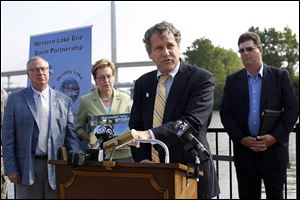 Sherrod Brown announces the availability of $2 million in federal funds to help farmers reduce runoff during a news conference Tuesday at the National Museum of Great Lakes in Toledo. 