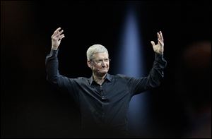 Apple CEO Tim Cook gestures during the Apple Worldwide Developers Conference in San Francisco in June.