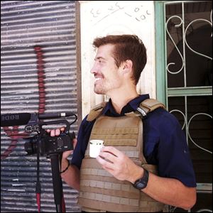 Journalist James Foley in Aleppo, Syria, in July, 2012. In a horrifying act of revenge for U.S. airstrikes in northern Iraq, militants with the Islamic State extremist group have beheaded Foley — and are threatening to kill another hostage, U.S. officials say. 