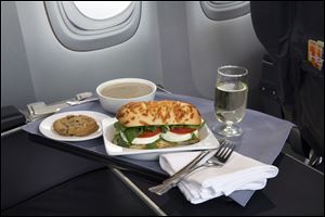 A Caprese on Asiago Baguette sandwich is one of a variety of United Airlines' new first class food options. 