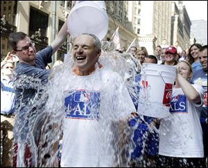 Major League Baseball Commissioner-elect Rob Manfred participates in the ALS Ice-Bucket Challenge outside the organization's headquarters in New York, Wednesday.