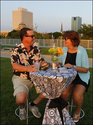 Joe and Brenda Cousino enjoy the Rooftop Bash on Aug. 9 at the Toledo-Lucas County Public Library Main Branch.