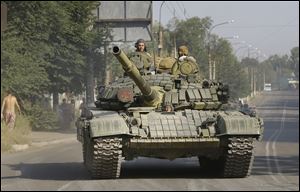 One of tanks in a convoy, heading from direction of Russia into town of Krasnodon in eastern Ukraine. 