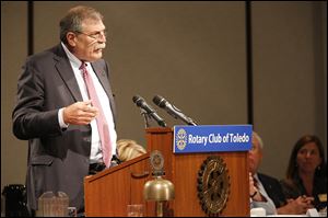Richard Ross, Ohio superintendent of public instruction, left, and John Carey, chancellor with the  Ohio Board of Regents, address members of the Rotary Club of Toledo during their meeting Monday in the Park Inn hotel downtown.