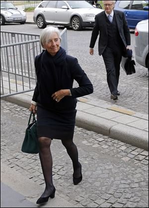 Lagarde arrives at a courthouse, in Paris, Wednesday, March 19, 2014.