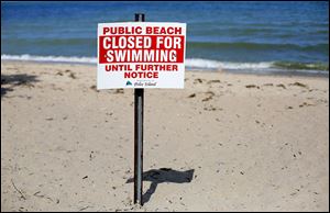 Signs on Pelee Island were one of many methods used to warn residents and tourists of water issues. Hun-dreds of fact sheets and notices were distributed too.