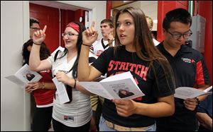 Cardinal Stritch seniors, from left, Katie Kromenacker, Cecelia Gozdowski, and Han Zhang, sing during a memorial service for Shelby Augustyniak. The service opened with the song ‘‍All Are Welcome’ and closed with ‘‍Our God is Greater.’