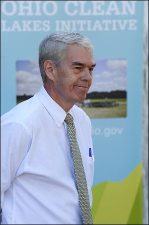 Senator Randy Gardner (R) - District 2, listens to speakers during a press conference concerning new efforts to improve water quality in Lake Erie.