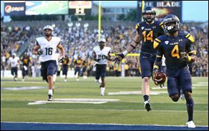University of Toledo WR Corey Jones (4) scores a touchdown against New Hampshire during the second quarter of a football game at the Glass Bowl Saturday.