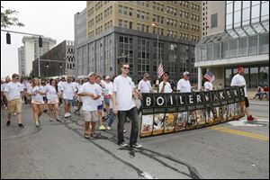 Members of the International Brotherhood of Boilermakers, Local 85, march in the Labor Day parade in downtown Toledo.