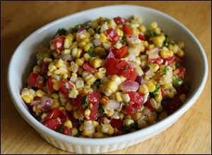 Corn and tomato salad with bits of lobster tail.