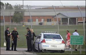 Police work in front of the Woodland Hills Youth Development Center Tuesday, Sept. 2, 2014, in Nashville, Tenn. 