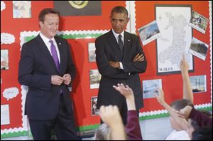 Prime Minister David Cameron, left, and President Obama visit Mount Pleasant Primary School in Newport, Wales, today on the sidelines of the NATO Summit. 