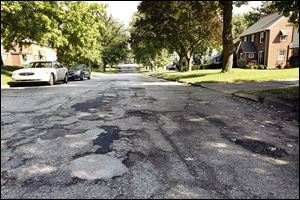 Above, the 2900 block of Algonquin Parkway in Toledo is on a list of 12 Toledo streets in Districts 1 and 3 to be repaved.