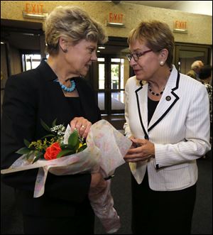 Authors! Authors! featured speaker Cokie Roberts, left, receives flowers from Congresswoman Marcy Kaptur prior to Roberts' speech at the Stranahan Theater.