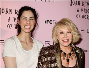 Comedians Sarah Silverman, left, and Joan Rivers pose during arrivals at the New York premiere of 
