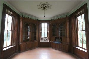 The first-floor library, in the base of the tower, has a 180-degree view of the lake.