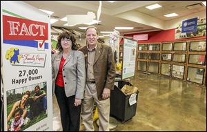 Deb, left, and John Stottele stand in the the Family Puppy store they own in the Franklin Park Mall in Toledo. Mr. Stottele said he works with 15 to 20 handpicked breeders.