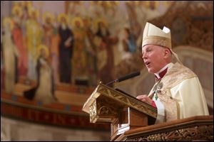 The Most Rev. Daniel Thomas delivers his homily during an evening prayer service at Rosary Cathedral a day before he is installed. At Tuesday’s service, he said he would follow Pope Francis’ instructions to bishops to ‘build and to love.’