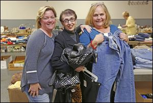 Event co-chairmen Shelli Jacobs, president Barbara Brown and co-chairman Judy Maurer at the Second Fiddle Sale at the Lucas County Rec Center in Maumee.