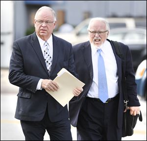 Bradford Huebner, left, arrives at federal court  for his sentencing with his attorney, Rick Kerger.