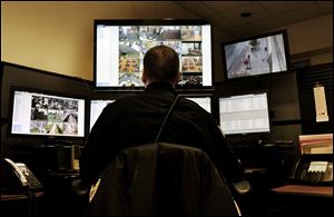 Security officer Mike Vascik watches the security camera feeds at the Main Library for suspicious activity, including damaging library property, arguments and disruptive behavior, and even sexual activity.