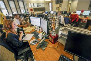 A monthly VIP trophy sits on the desk of Emily Krieger. The goal at U.S. Xpress, supervisors say, is to focus on the little things that make people enjoy coming to work.